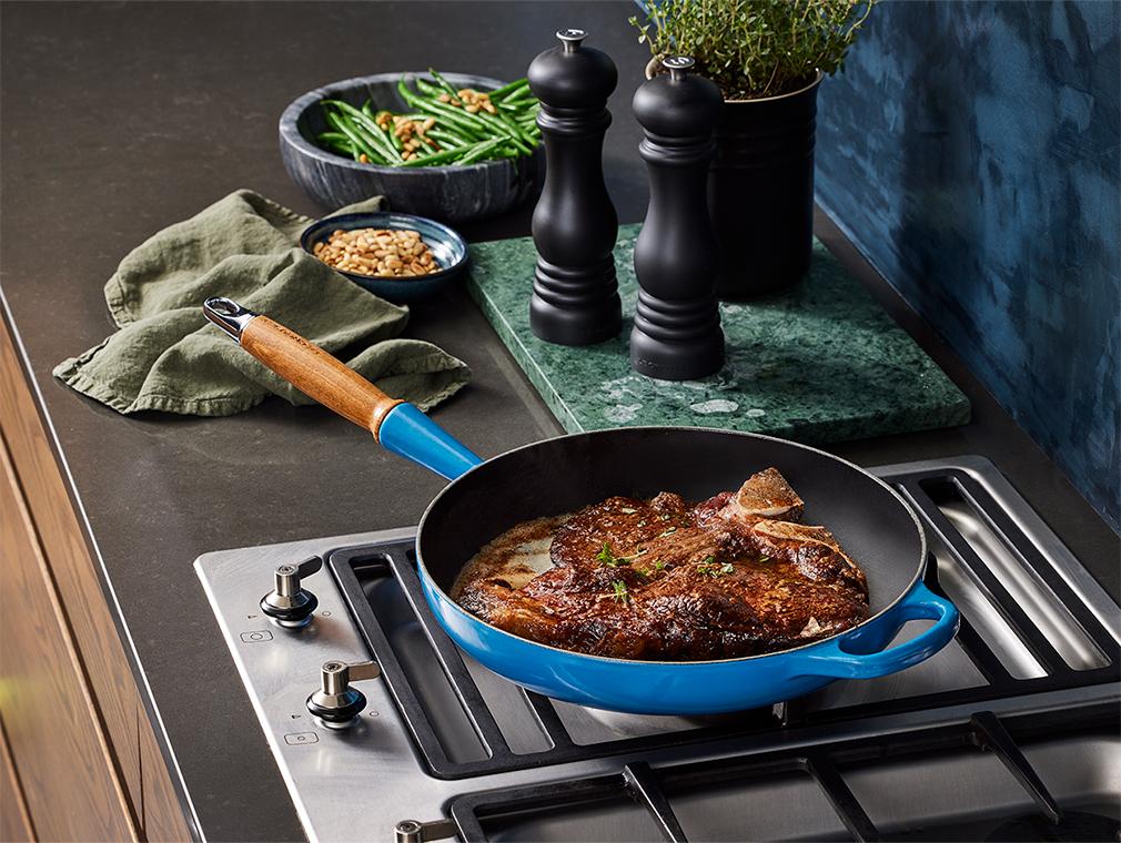 T-bone met zwarte knoflookboter en fijne sperziebonen